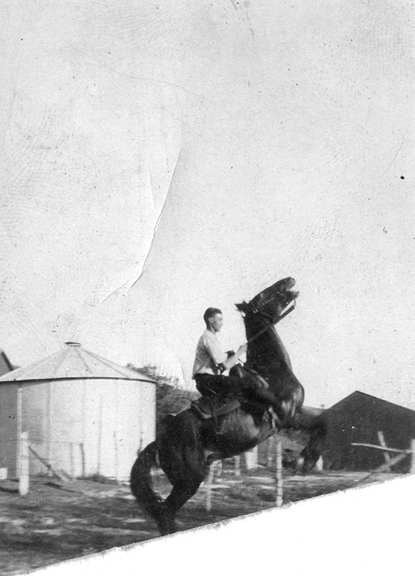George Wooby riding a horse at a farm in Newark, NJ